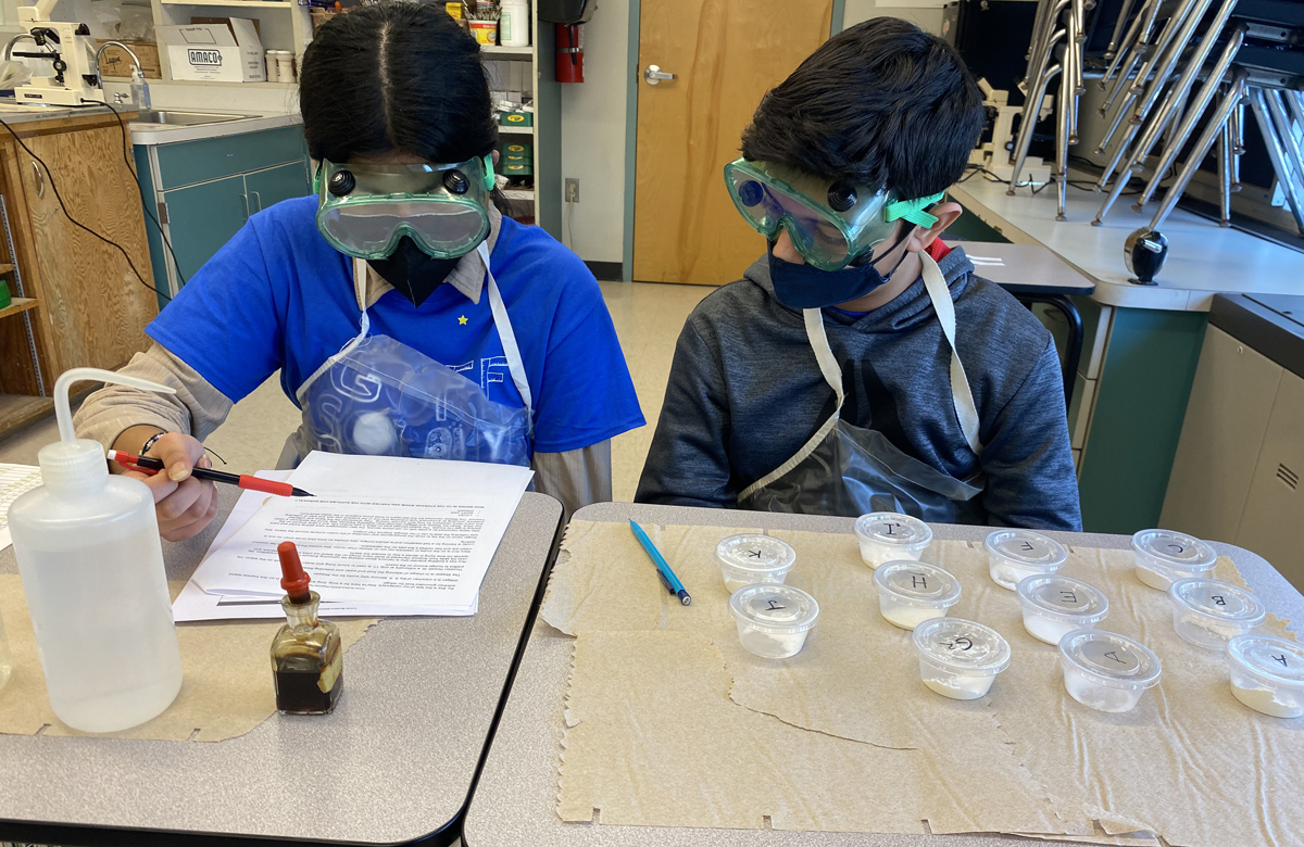 Students participating in the Crime Busters event at the Science Olympiad regional tournament