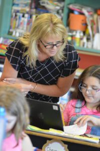 Mrs. Hart checking a student's work