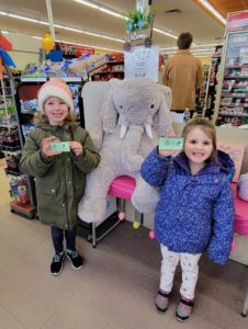 Students with Veda the stuffed elephant at Family Dollar in Nassau