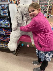 Students with Veda the stuffed elephant at Family Dollar in Nassau