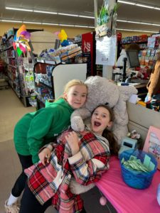 Students with Veda the stuffed elephant at Family Dollar in Nassau
