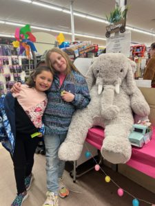Students with Veda the stuffed elephant at Family Dollar in Nassau