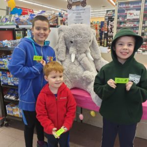 Students with Veda the stuffed elephant at Family Dollar in Nassau