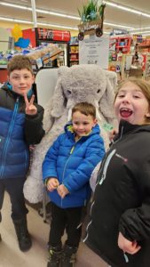 Students with Veda the stuffed elephant at Family Dollar in Nassau