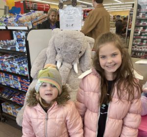 Students with Veda the stuffed elephant at Family Dollar in Nassau