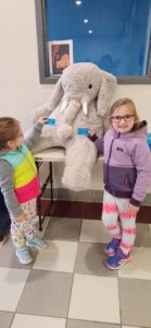 Students with Veda the stuffed elephant at the East Greenbush YMCA
