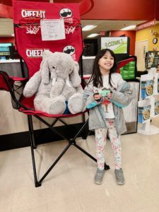 A student with Veda the stuffed elephant at Hannaford in East Greenbush
