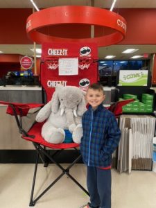 A student with Veda the stuffed elephant at Hannaford in East Greenbush