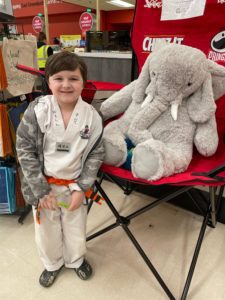 A student with Veda the stuffed elephant at Hannaford in East Greenbush