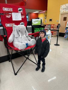 A student with Veda the stuffed elephant at Hannaford in East Greenbush