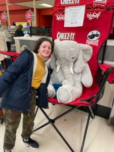 A student with Veda the stuffed elephant at Hannaford in East Greenbush