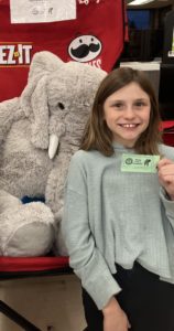 A student with Veda the stuffed elephant at Hannaford in East Greenbush