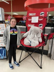 A student with Veda the stuffed elephant at Hannaford in East Greenbush