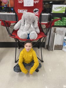 A student with Veda the stuffed elephant at Hannaford in East Greenbush