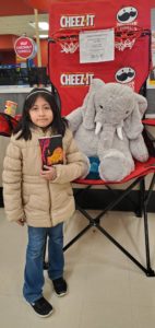 A student with Veda the stuffed elephant at Hannaford in East Greenbush