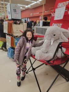 A student with Veda the stuffed elephant at Hannaford in East Greenbush