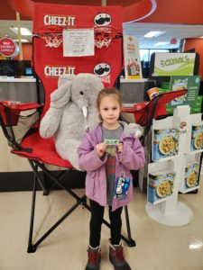 A student with Veda the stuffed elephant at Hannaford in East Greenbush