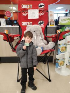 A student with Veda the stuffed elephant at Hannaford in East Greenbush