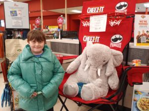 A student with Veda the stuffed elephant at Hannaford in East Greenbush