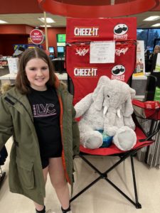 A student with Veda the stuffed elephant at Hannaford in East Greenbush