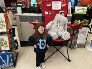 A student with Veda the stuffed elephant at Hannaford in East Greenbush