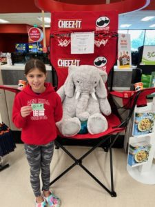 A student with Veda the stuffed elephant at Hannaford in East Greenbush