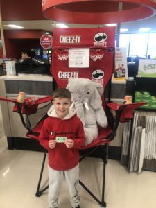 A student with Veda the stuffed elephant at Hannaford in East Greenbush