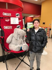 A student with Veda the stuffed elephant at Hannaford in East Greenbush