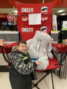 A student with Veda the stuffed elephant at Hannaford in East Greenbush