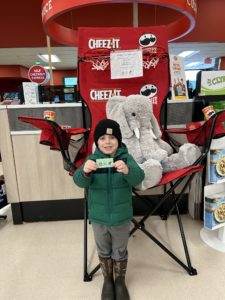 A student with Veda the stuffed elephant at Hannaford in East Greenbush
