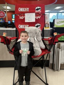 A student with Veda the stuffed elephant at Hannaford in East Greenbush