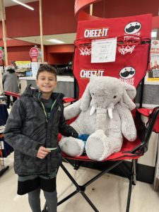 A student with Veda the stuffed elephant at Hannaford in East Greenbush