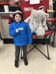 A student with Veda the stuffed elephant at Hannaford in East Greenbush