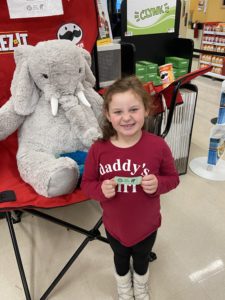 A student with Veda the stuffed elephant at Hannaford in East Greenbush