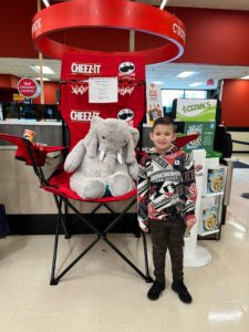 A student with Veda the stuffed elephant at Hannaford in East Greenbush