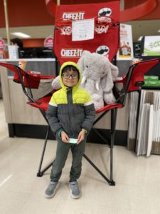 A student with Veda the stuffed elephant at Hannaford in East Greenbush