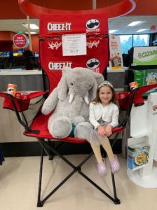 A student with Veda the stuffed elephant at Hannaford in East Greenbush