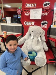 A student with Veda the stuffed elephant at Hannaford in East Greenbush