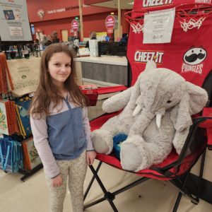 A student with Veda the stuffed elephant at Hannaford in East Greenbush