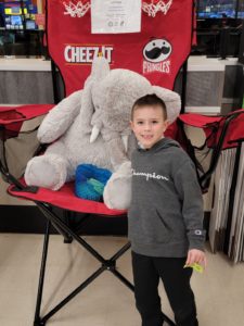 A student with Veda the stuffed elephant at Hannaford in East Greenbush
