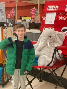 A student with Veda the stuffed elephant at Hannaford in East Greenbush