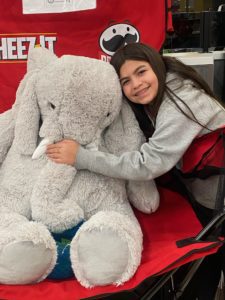 A student with Veda the stuffed elephant at Hannaford in East Greenbush