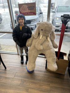 A student with Veda the stuffed elephant at Stewart's in East Greenbush.