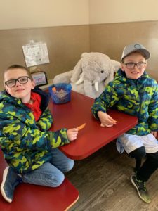 Students with Veda the stuffed elephant at Stewart's in Nassau