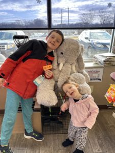 Students with Veda the stuffed elephant at Stewart's in Nassau