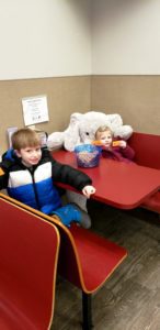 A student with Veda the stuffed elephant at Stewart's in Nassau