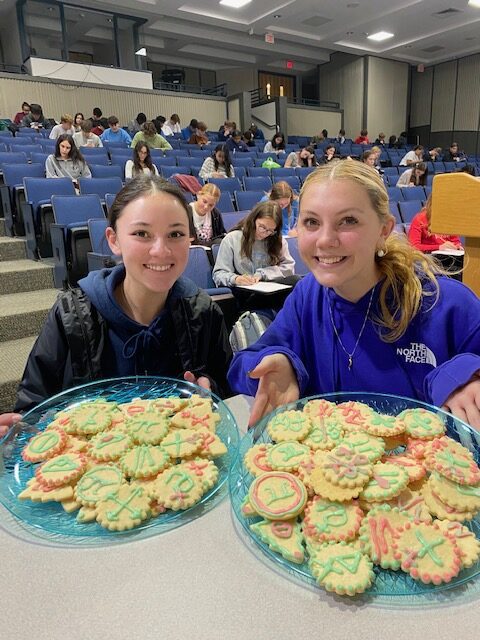 Math League cco-presidents Eden Ladd and Kiera Miller helped the group celebrate the holidays with math-themed cookies