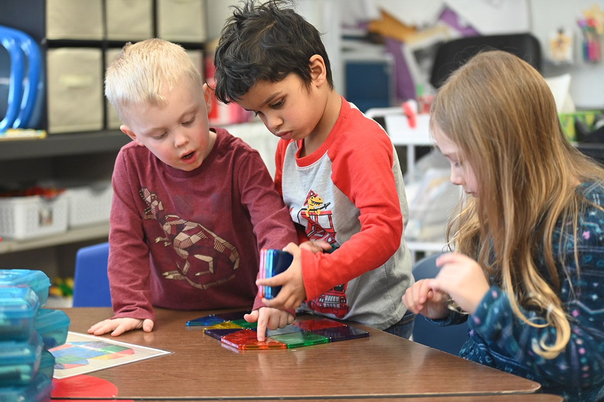 Green Meadow Pre-K students working together with magnetiles